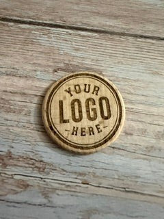 Valley Laserworks custom wooden beer chip with 'Your Logo Here' engraved in a circular design.
